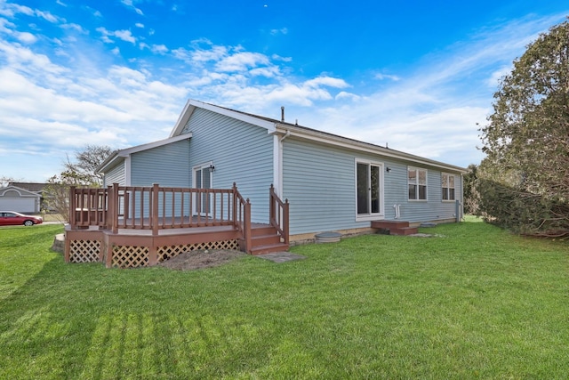 back of property with a deck and a lawn