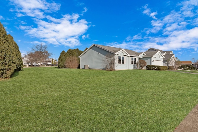 view of property exterior with a lawn