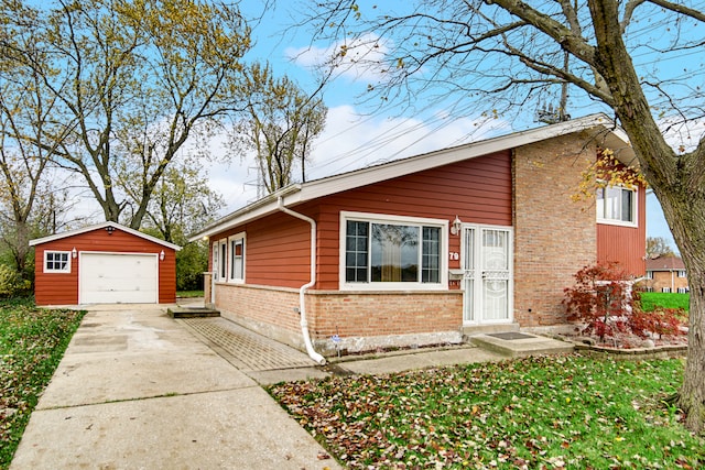 view of front of home with an outbuilding and a garage