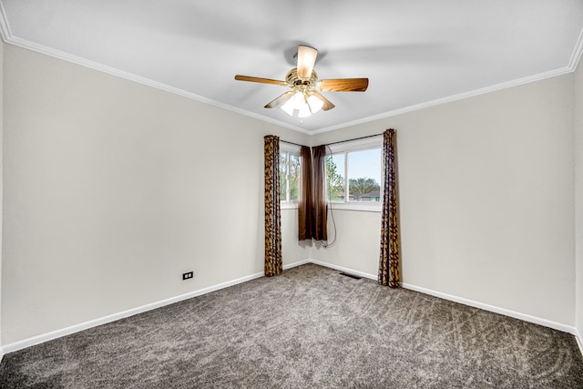 carpeted spare room with ceiling fan and ornamental molding