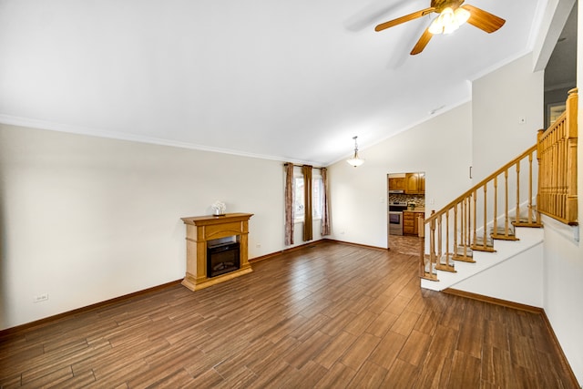 unfurnished living room featuring ceiling fan, vaulted ceiling, dark hardwood / wood-style floors, and crown molding