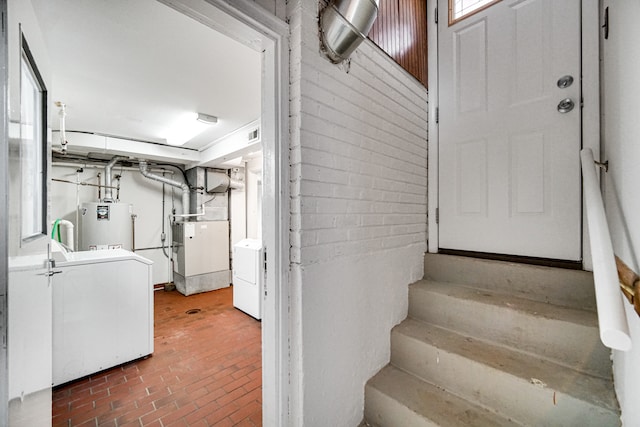 interior space with water heater and independent washer and dryer