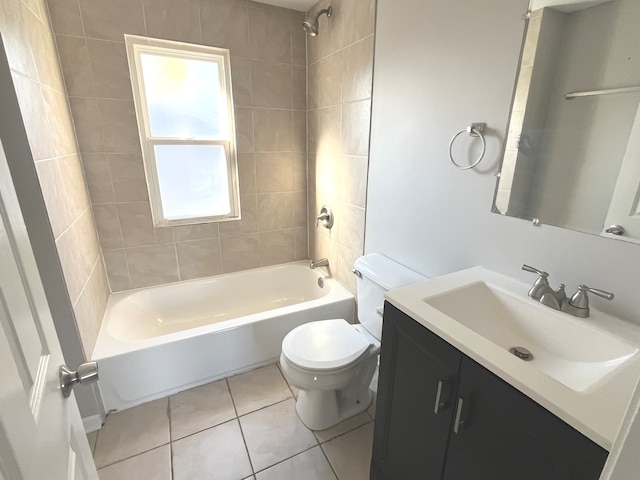 full bathroom with toilet, vanity, tiled shower / bath combo, and tile patterned floors