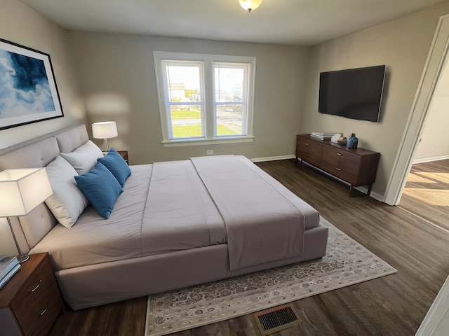 bedroom featuring dark hardwood / wood-style flooring