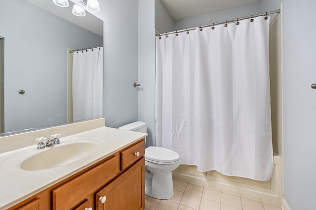 full bathroom with tile patterned floors, vanity, toilet, and shower / bath combo