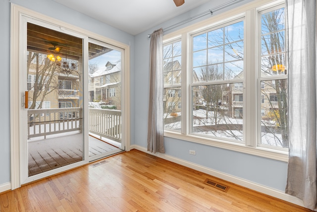 entryway featuring hardwood / wood-style flooring and ceiling fan