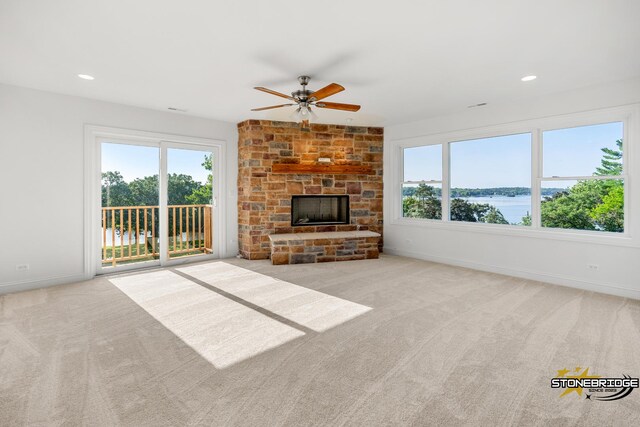 wooden terrace featuring a water view