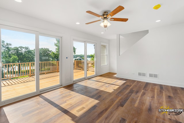 interior space featuring hardwood / wood-style floors and ceiling fan