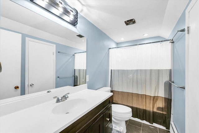 bathroom with vanity, tile patterned floors, and toilet