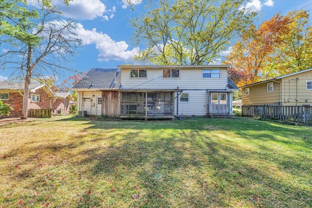 rear view of house with a lawn