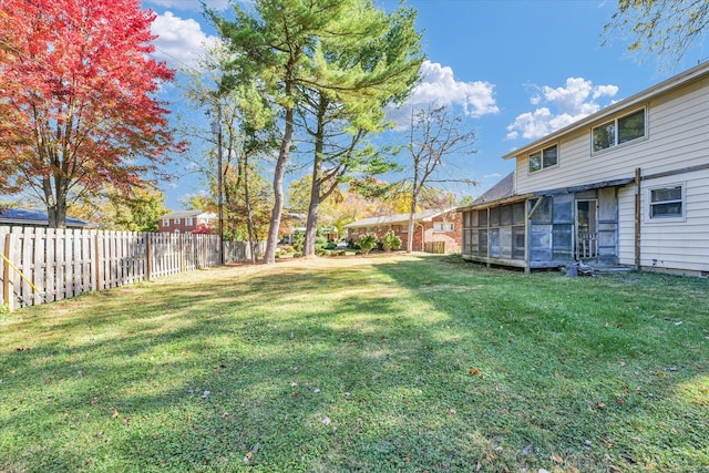 view of yard with a sunroom