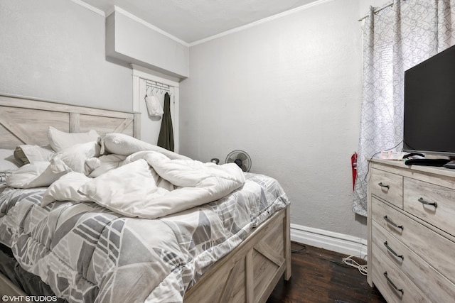 bedroom featuring dark hardwood / wood-style floors and ornamental molding