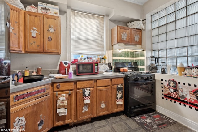 kitchen with black appliances and a healthy amount of sunlight