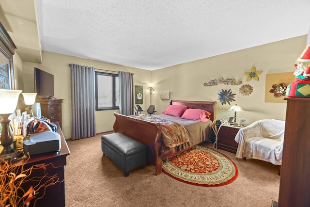 bedroom featuring a textured ceiling and carpet