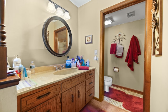 bathroom with vanity and toilet