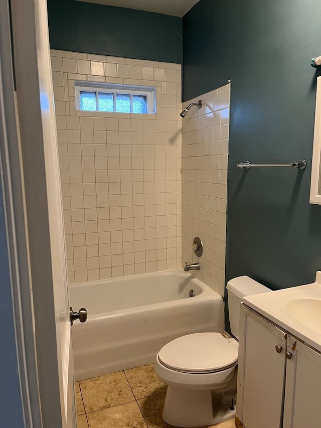 full bathroom with tile patterned floors, vanity, toilet, and tiled shower / bath