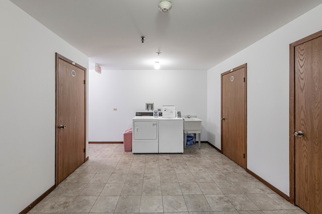 clothes washing area featuring washing machine and clothes dryer