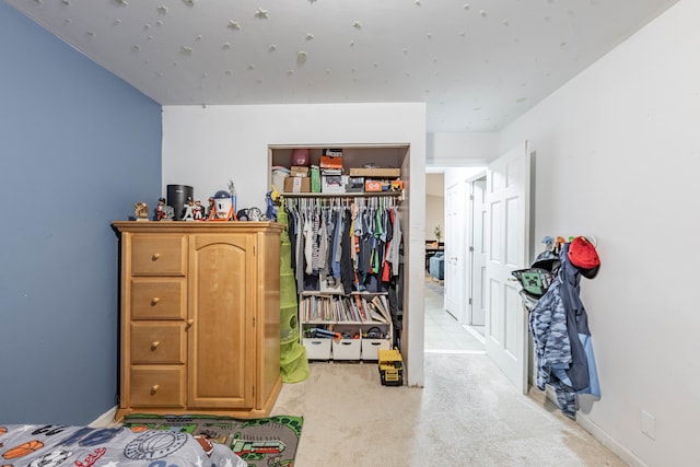 carpeted bedroom with a closet