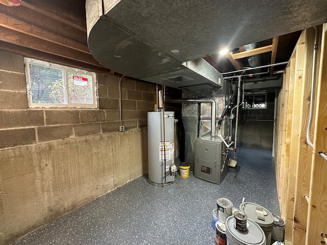 basement with gas water heater and heating unit