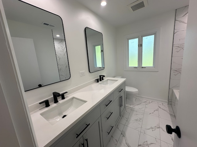 full bathroom featuring vanity, toilet, and bathtub / shower combination