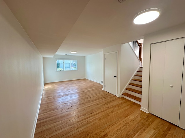 basement featuring light hardwood / wood-style floors