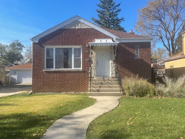 bungalow featuring a garage, a front lawn, and an outdoor structure