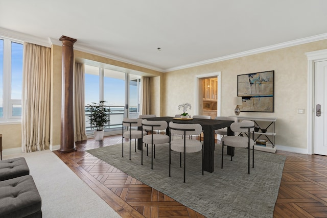 dining room with plenty of natural light, dark parquet flooring, and ornamental molding