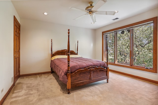 bedroom with light carpet and ceiling fan