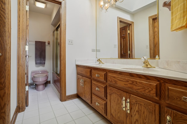 full bathroom featuring toilet, tile patterned floors, a chandelier, combined bath / shower with glass door, and vanity