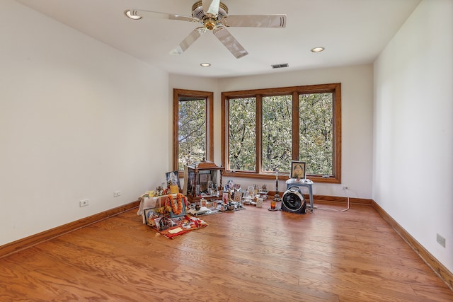 misc room with light wood-type flooring and ceiling fan