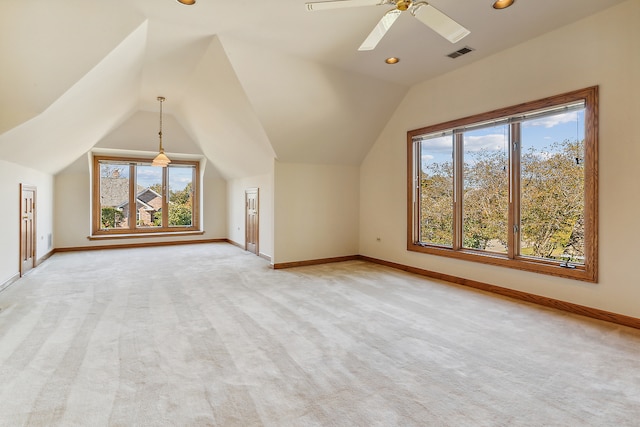 bonus room featuring ceiling fan, light colored carpet, and lofted ceiling