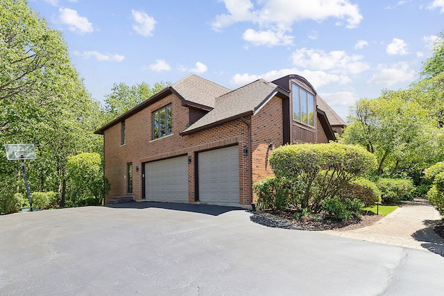 view of side of property featuring a garage