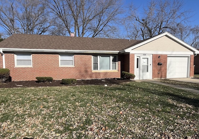 single story home featuring a front yard and a garage