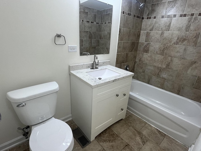 full bathroom featuring vanity, toilet, and tiled shower / bath