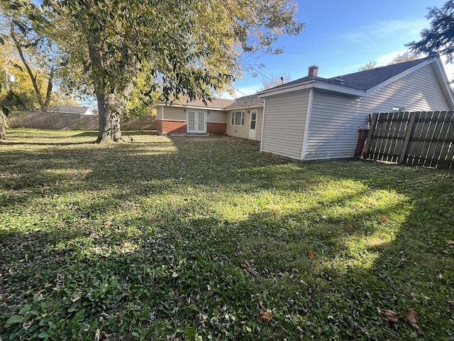 view of yard with french doors