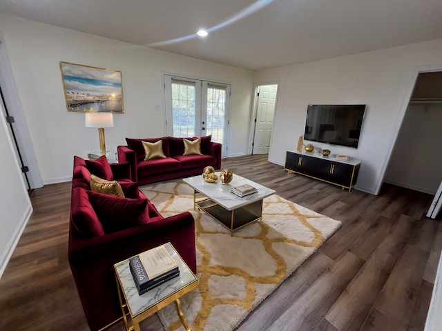 living room with dark wood-type flooring and french doors