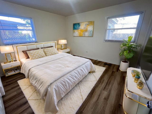 bedroom featuring dark wood-type flooring