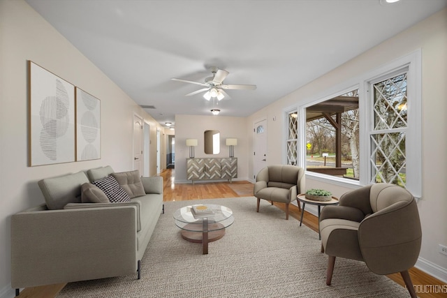 interior space with ceiling fan and light wood-type flooring