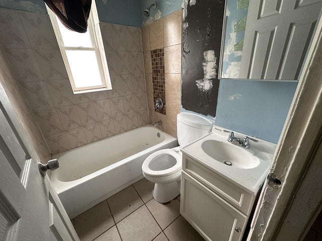 full bathroom featuring tile patterned floors, vanity, tiled shower / bath combo, and toilet