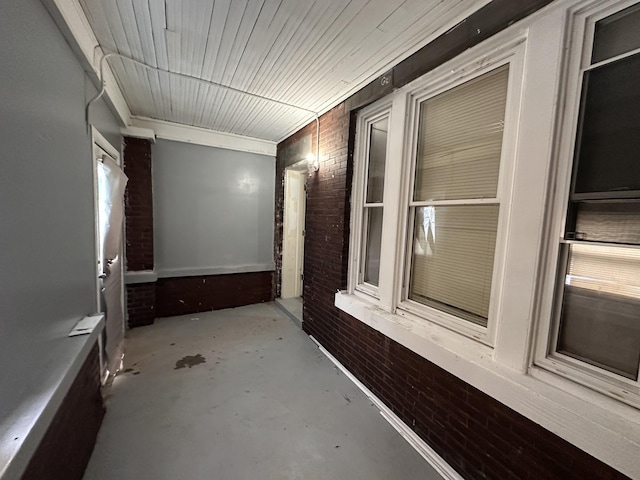 hallway with brick wall