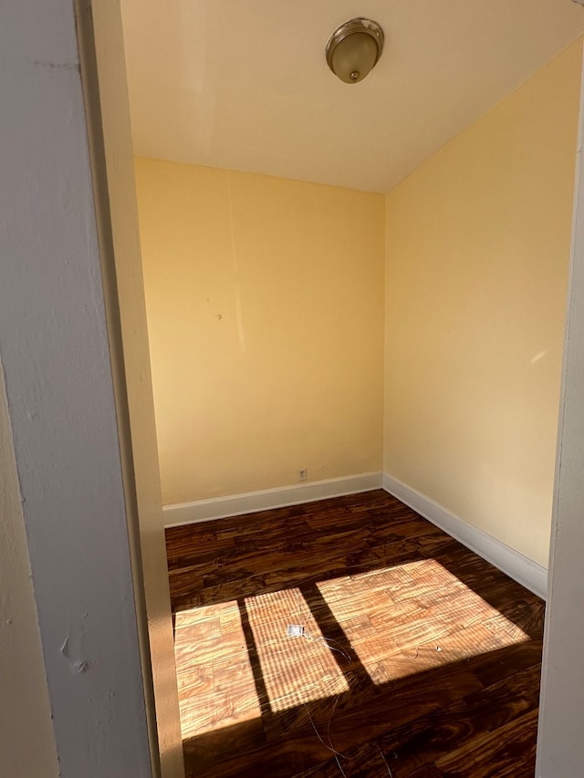 unfurnished room featuring dark hardwood / wood-style floors