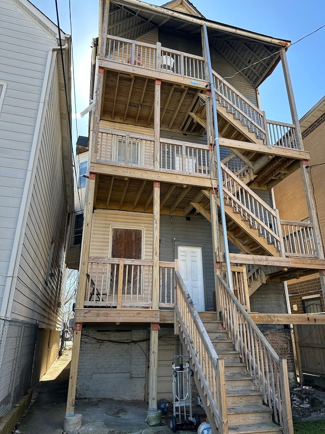 rear view of house with a balcony