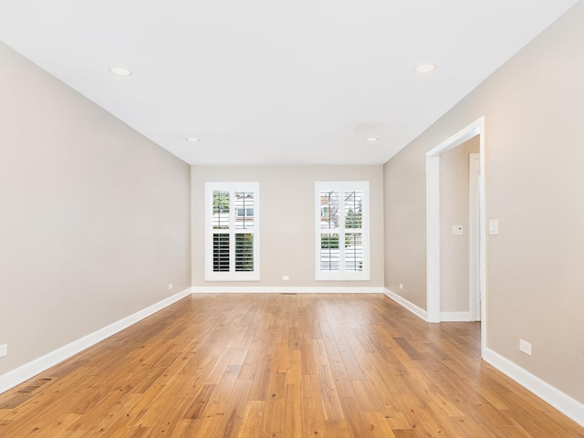 unfurnished room featuring light hardwood / wood-style floors