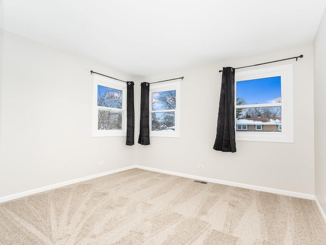 spare room featuring carpet floors