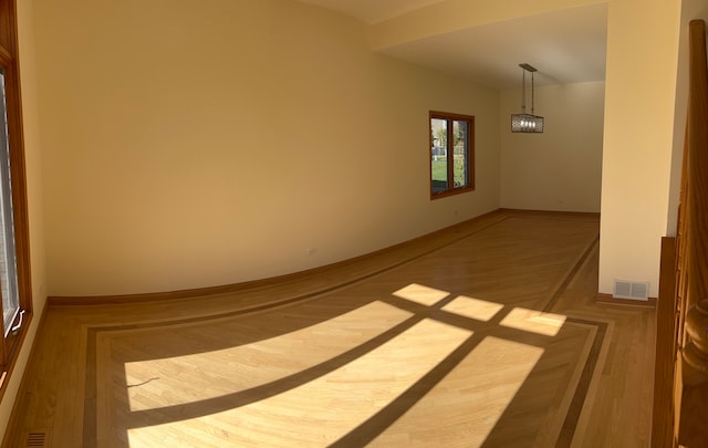 empty room with hardwood / wood-style flooring