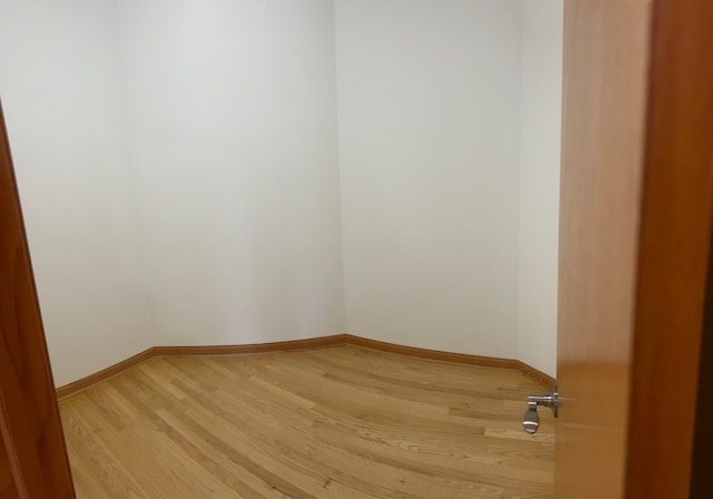 spare room featuring light hardwood / wood-style flooring