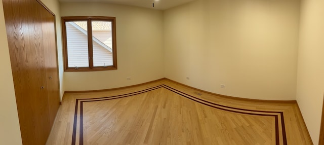 unfurnished room featuring wood-type flooring