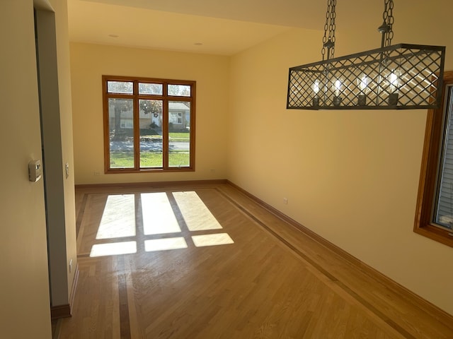 unfurnished room featuring hardwood / wood-style floors