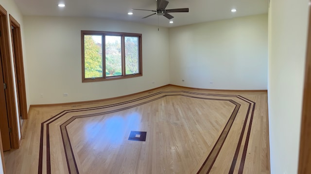 unfurnished room featuring light hardwood / wood-style floors and ceiling fan