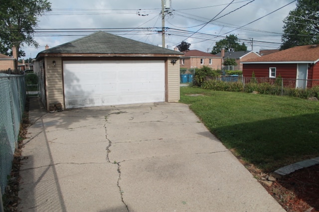 garage featuring a lawn